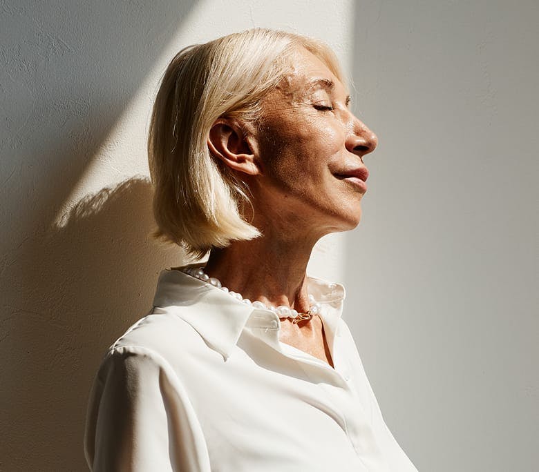 woman with short hair facing the sunlight