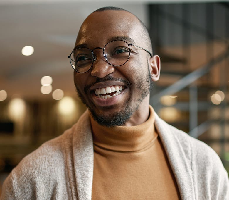man with glasses smiling
