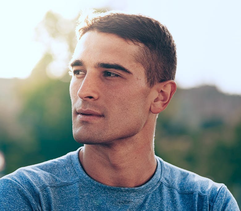 man with short hair looking to the left