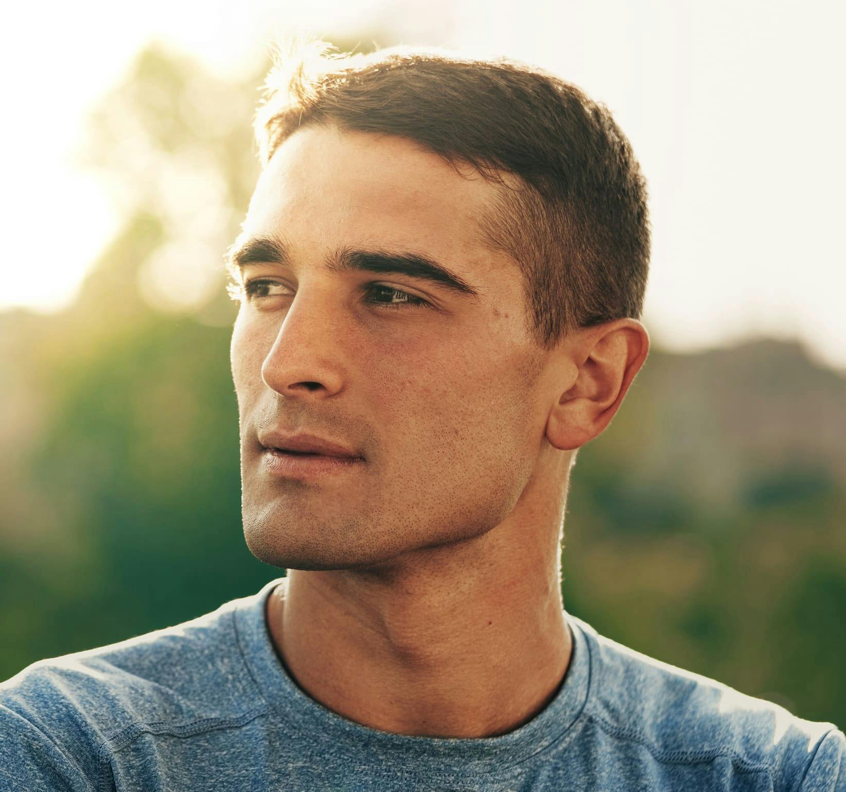 man looking to the left outside