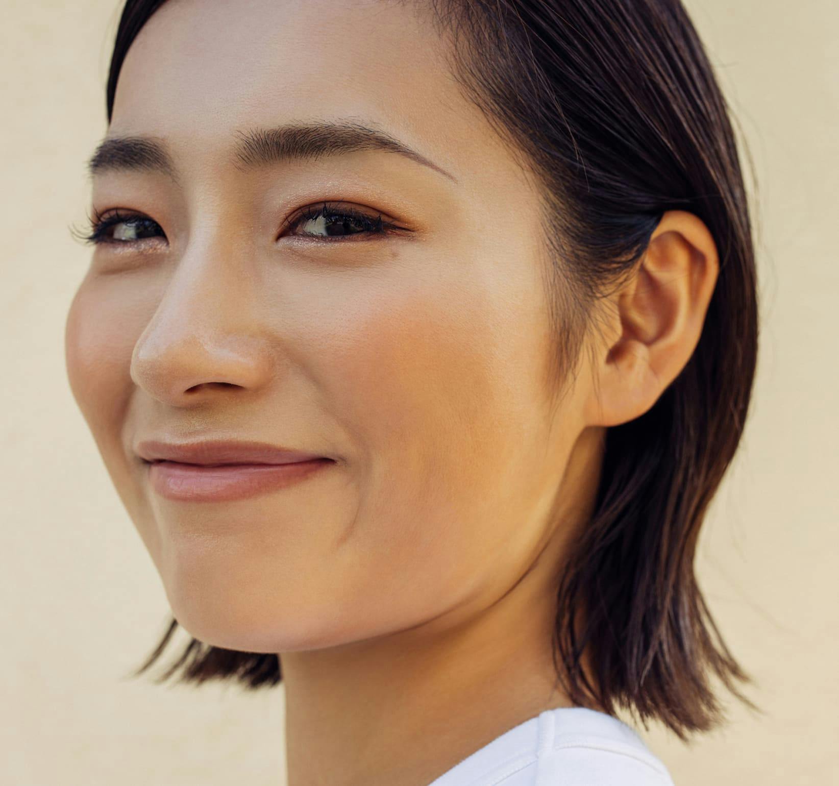 woman with short hair smiling