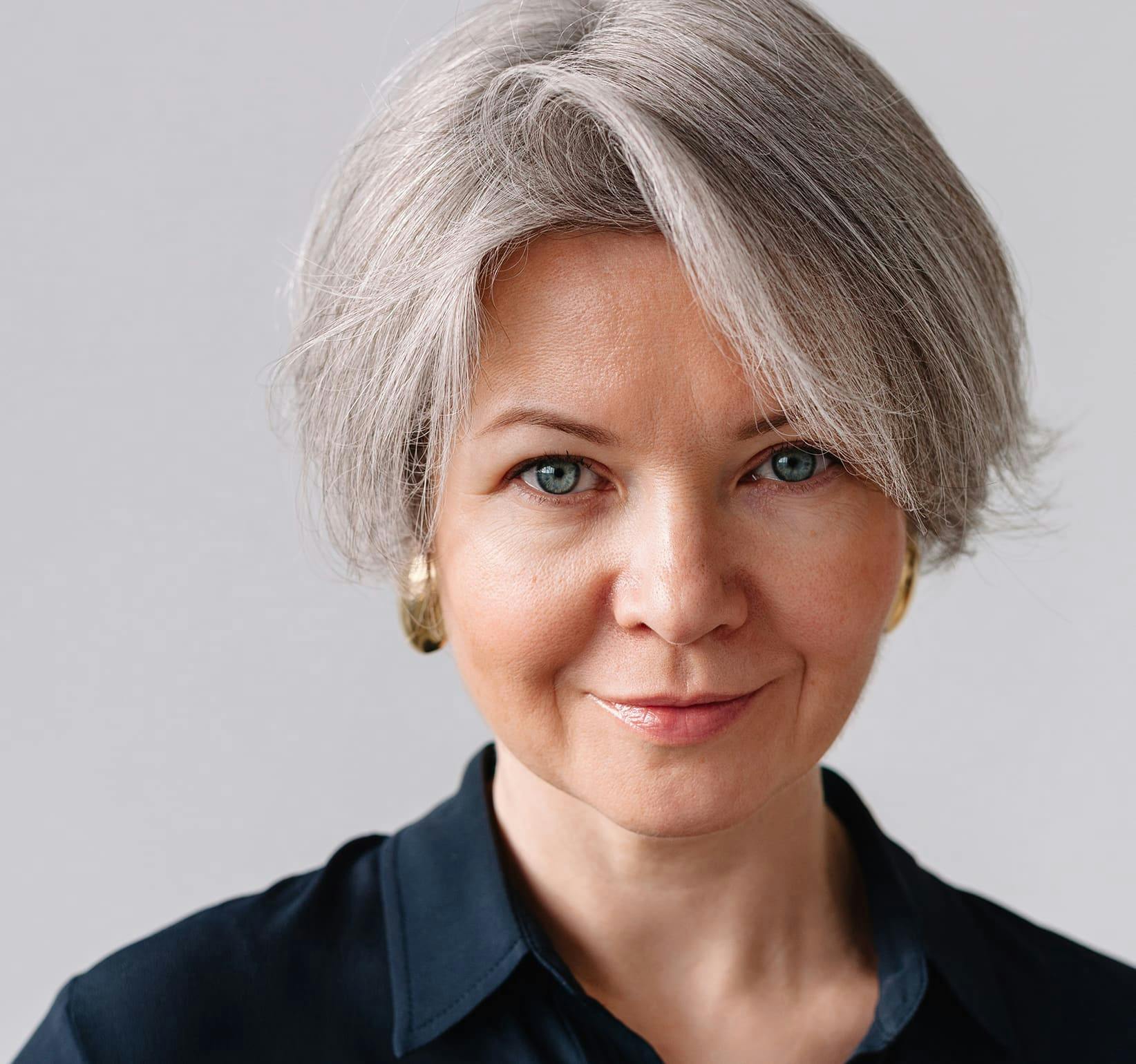 woman with gray hair looking forward