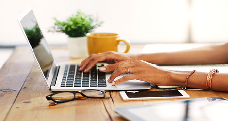 Person typing on laptop
