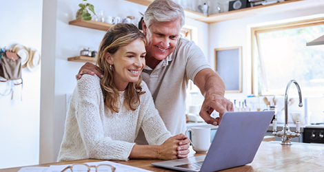 Couple looking at laptop together