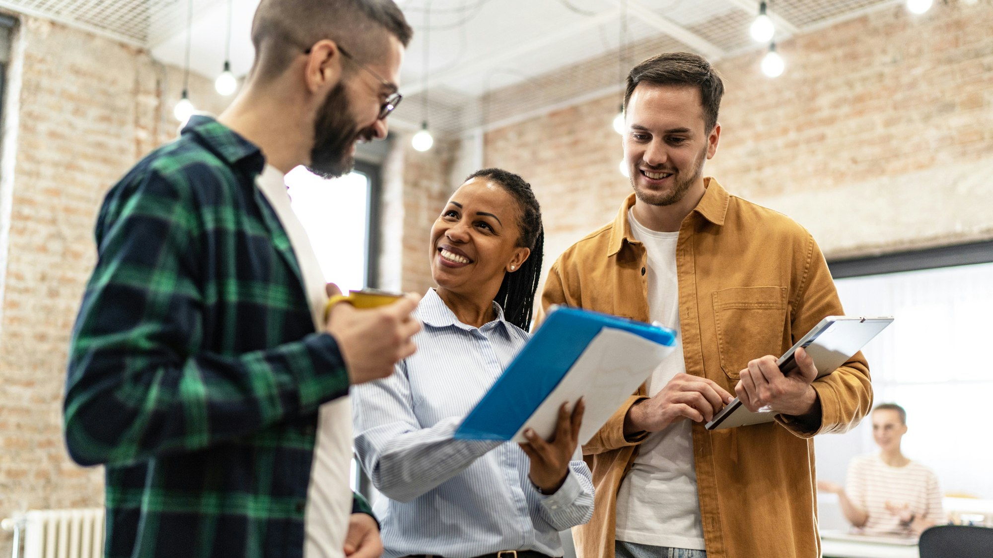 Small business employees talking together.