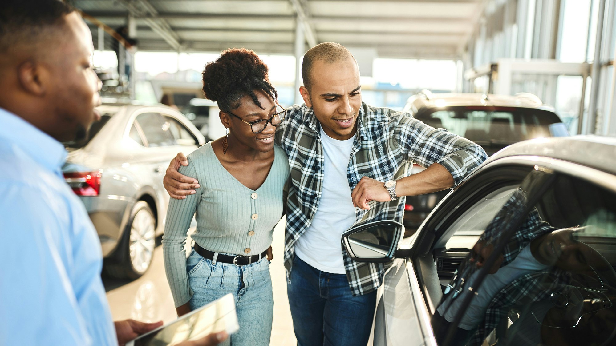 Couple at car dealership