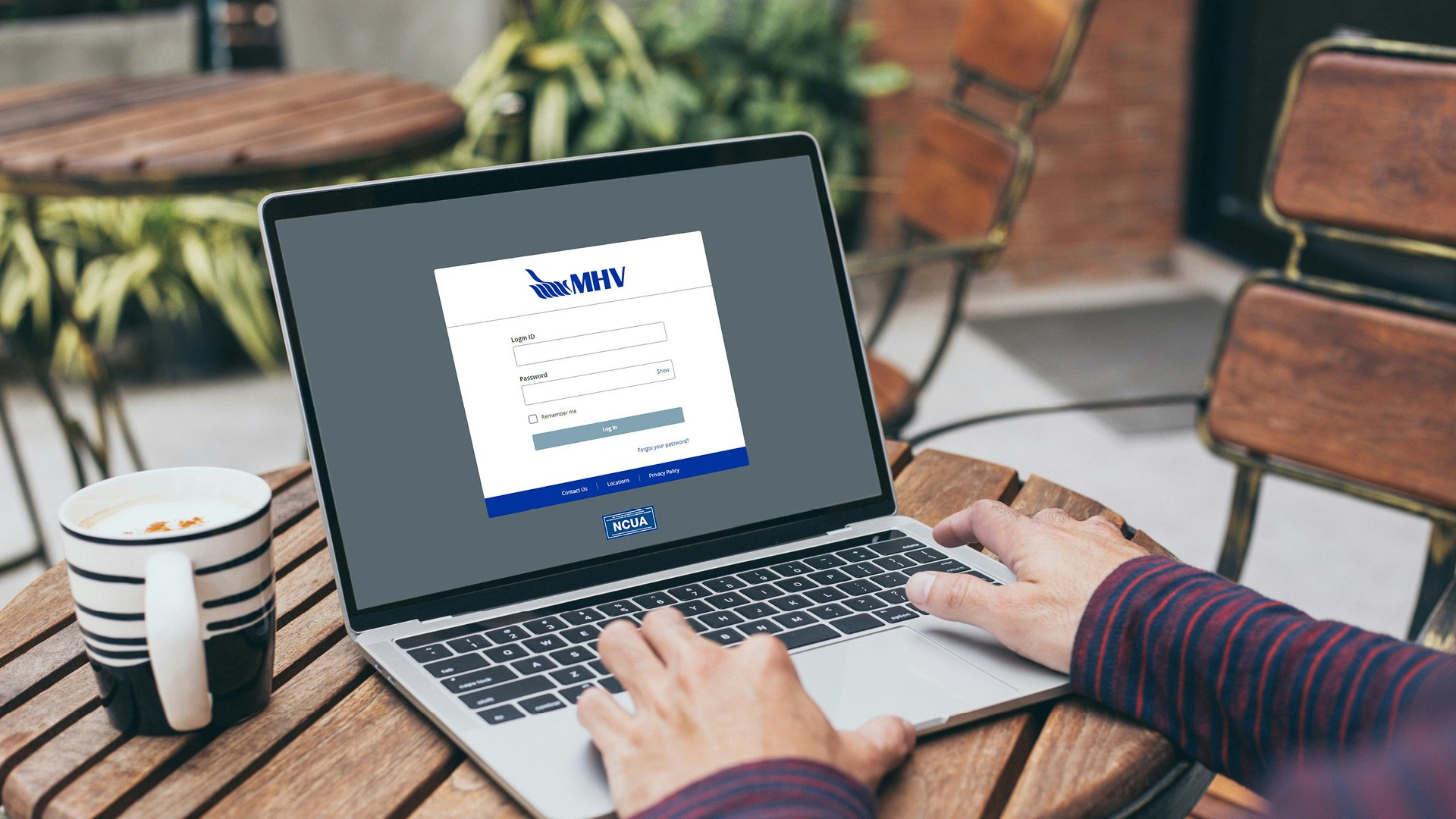 man logging onto MHV portal on computer