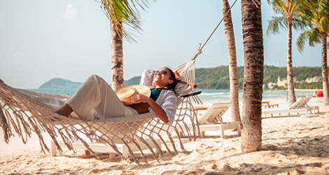 Woman laying in hammock on vacation
