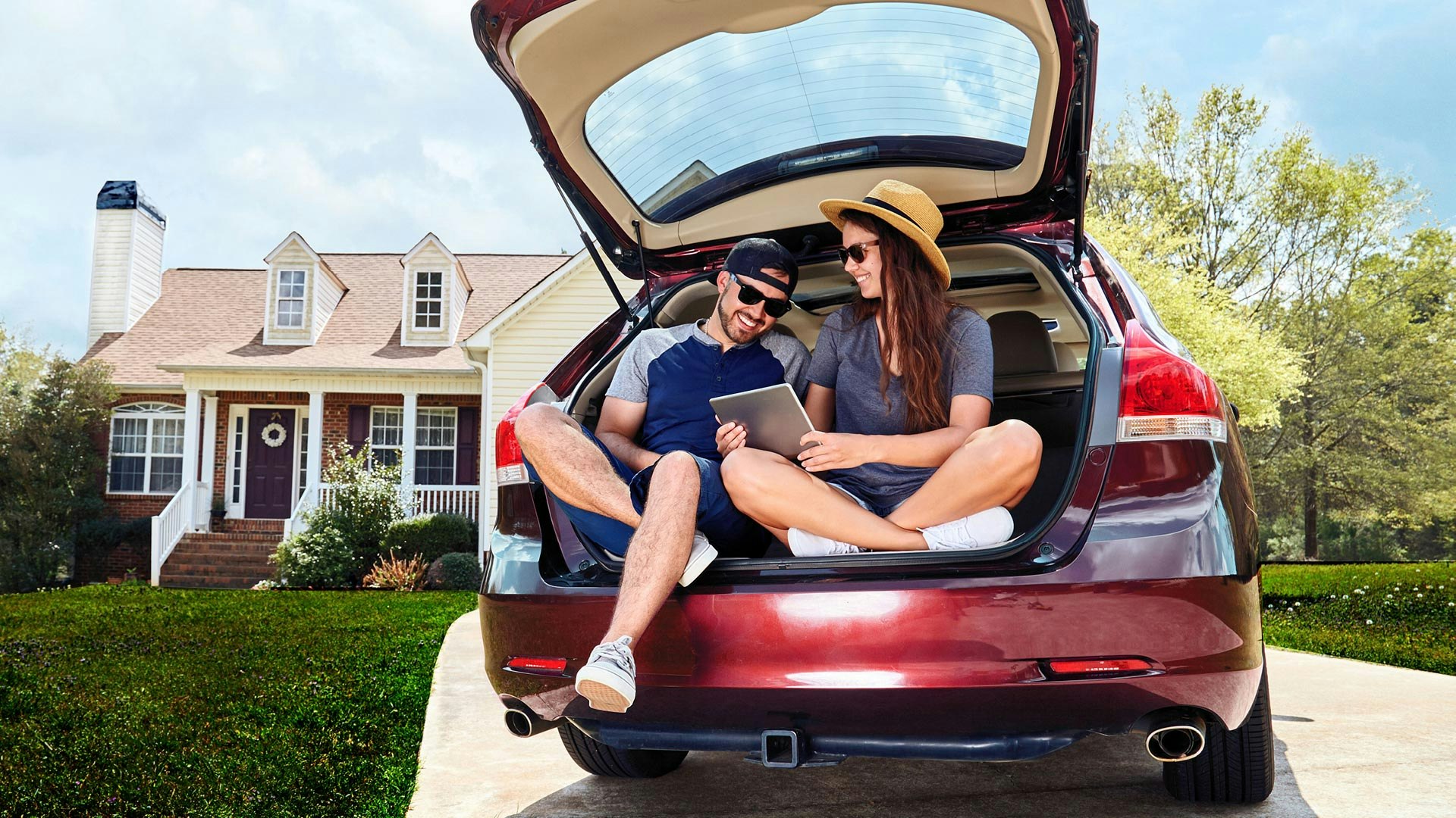 Couple sitting in back of car
