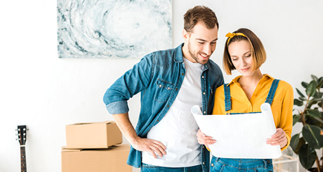 A couple looking at their home renovation plans