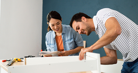 Couple putting stuff together for home