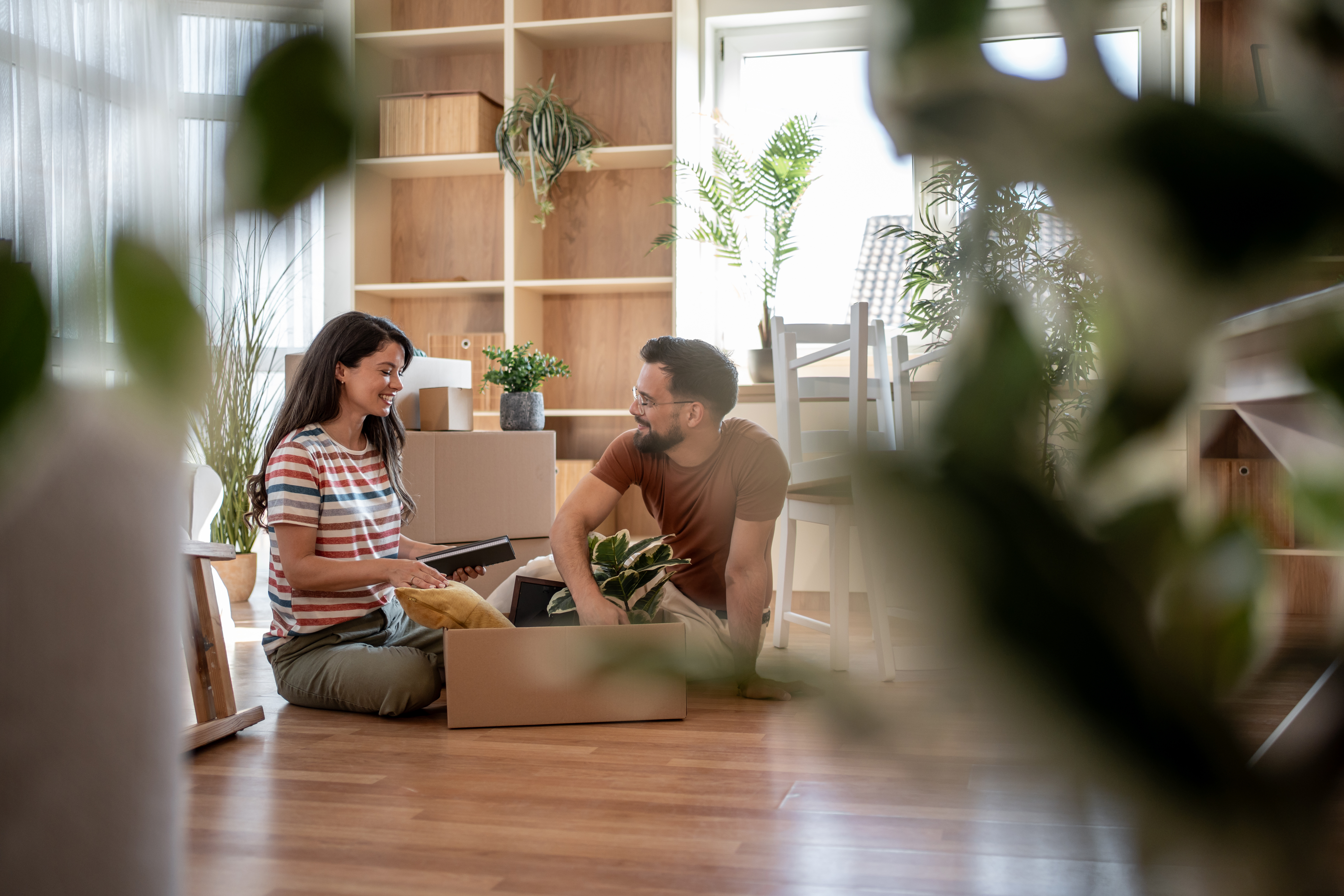 man and woman unpacking in home