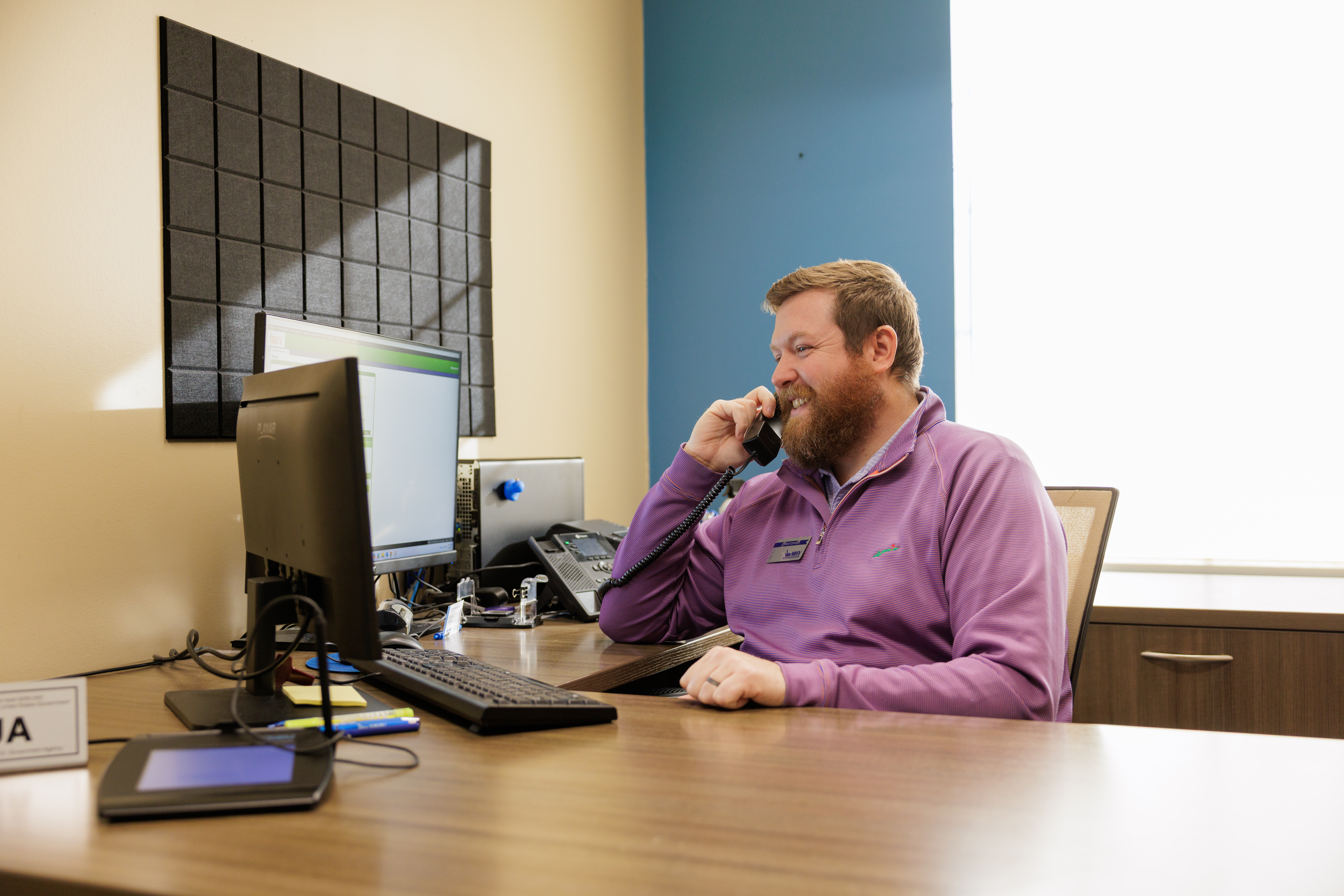Man answering phone at MHV branch bank