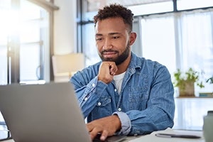 man looking at laptop