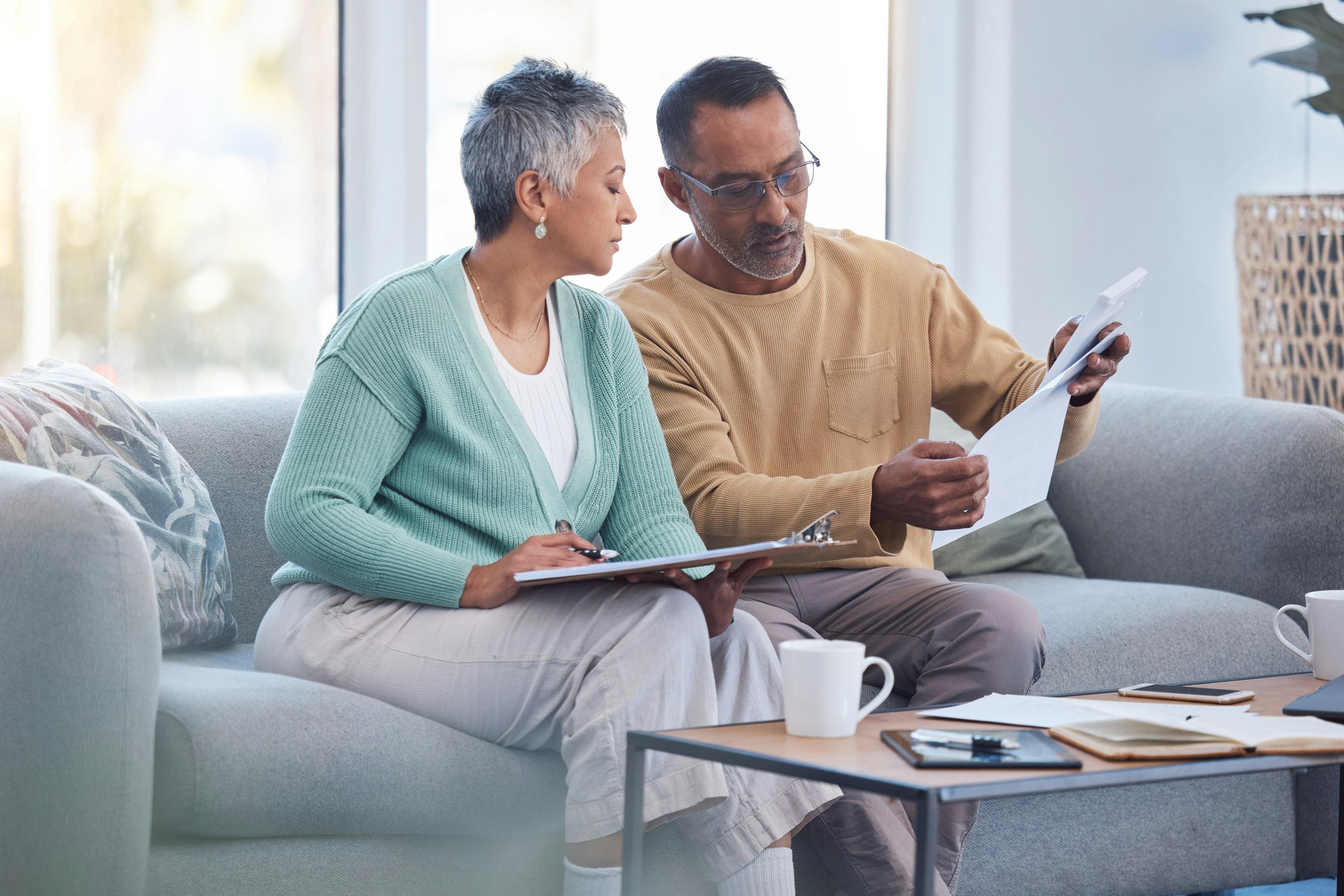 Man and woman talking on couch
