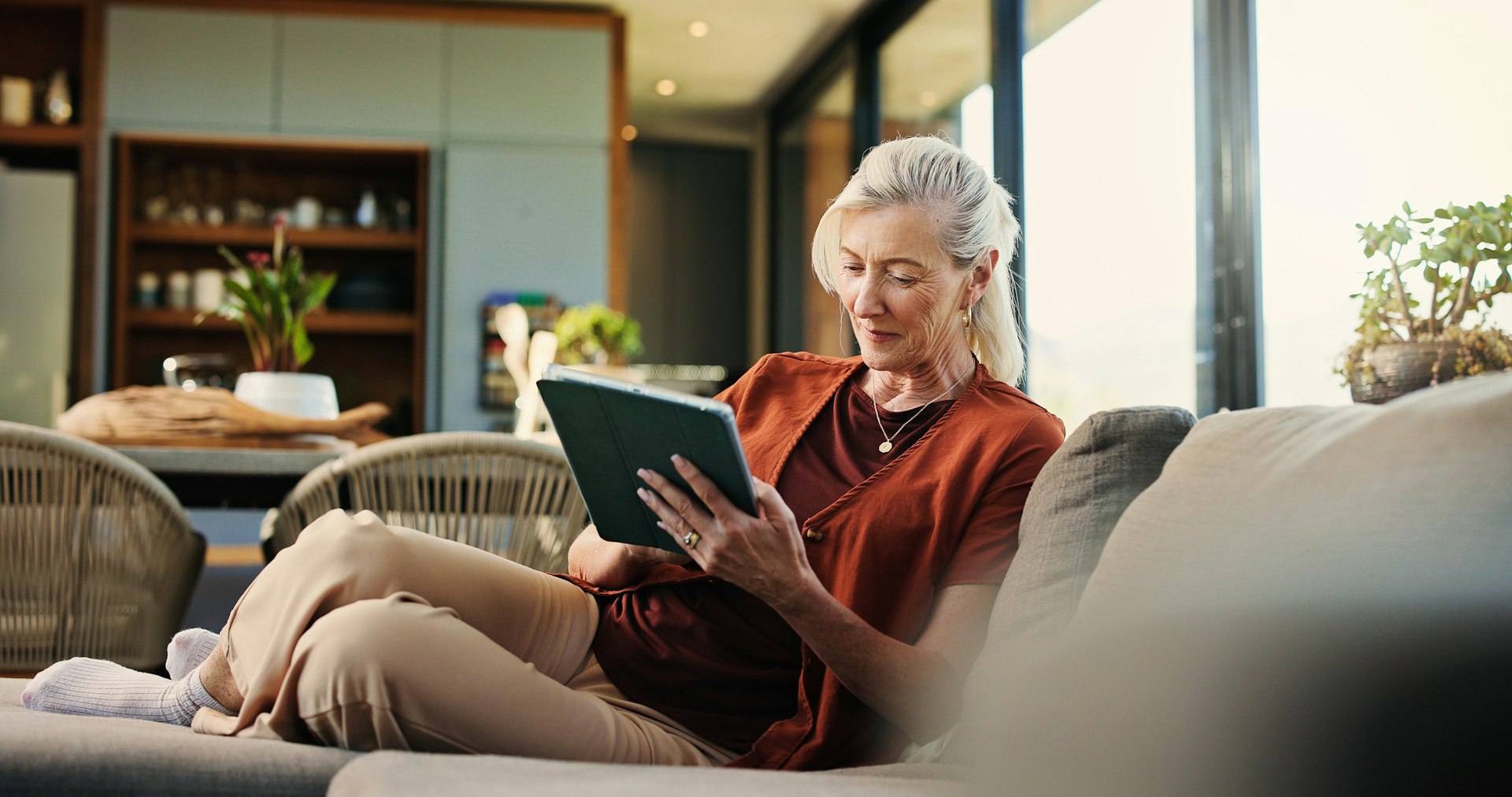 Woman on couch with ipad