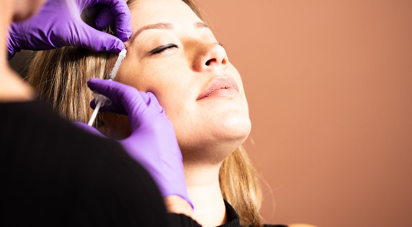 Nurse performing injections
