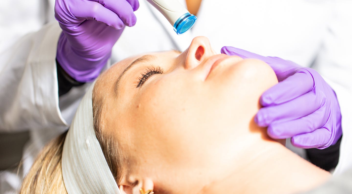 Nurse performing treatment on patient
