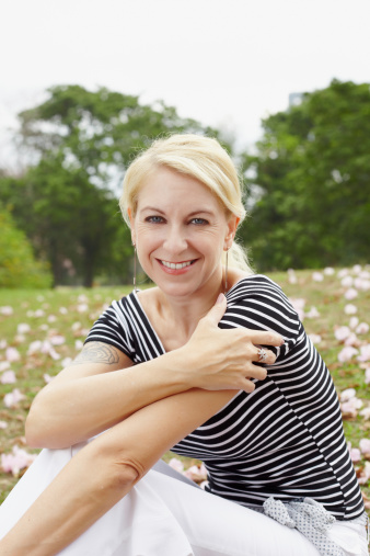 Woman sitting on grass.