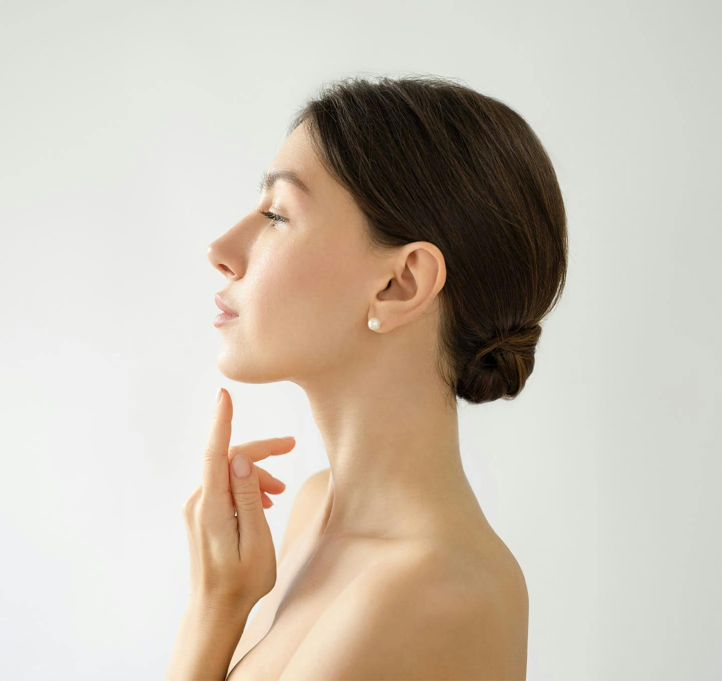 Woman touching her chin side profle