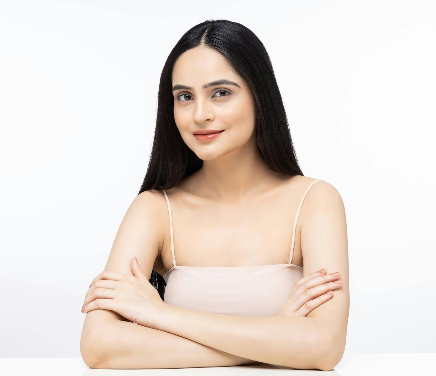 Woman smiling with arms crossed