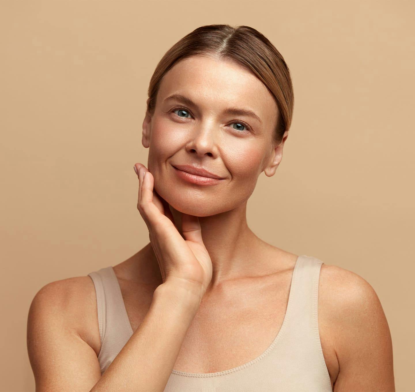 Woman touching chin and smiling