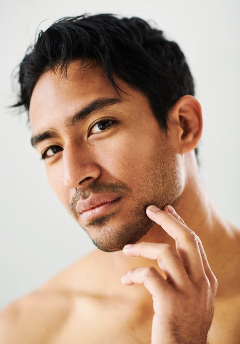 Man touching his jaw