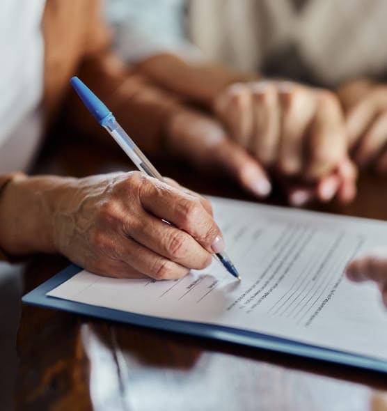 person signing paperwork