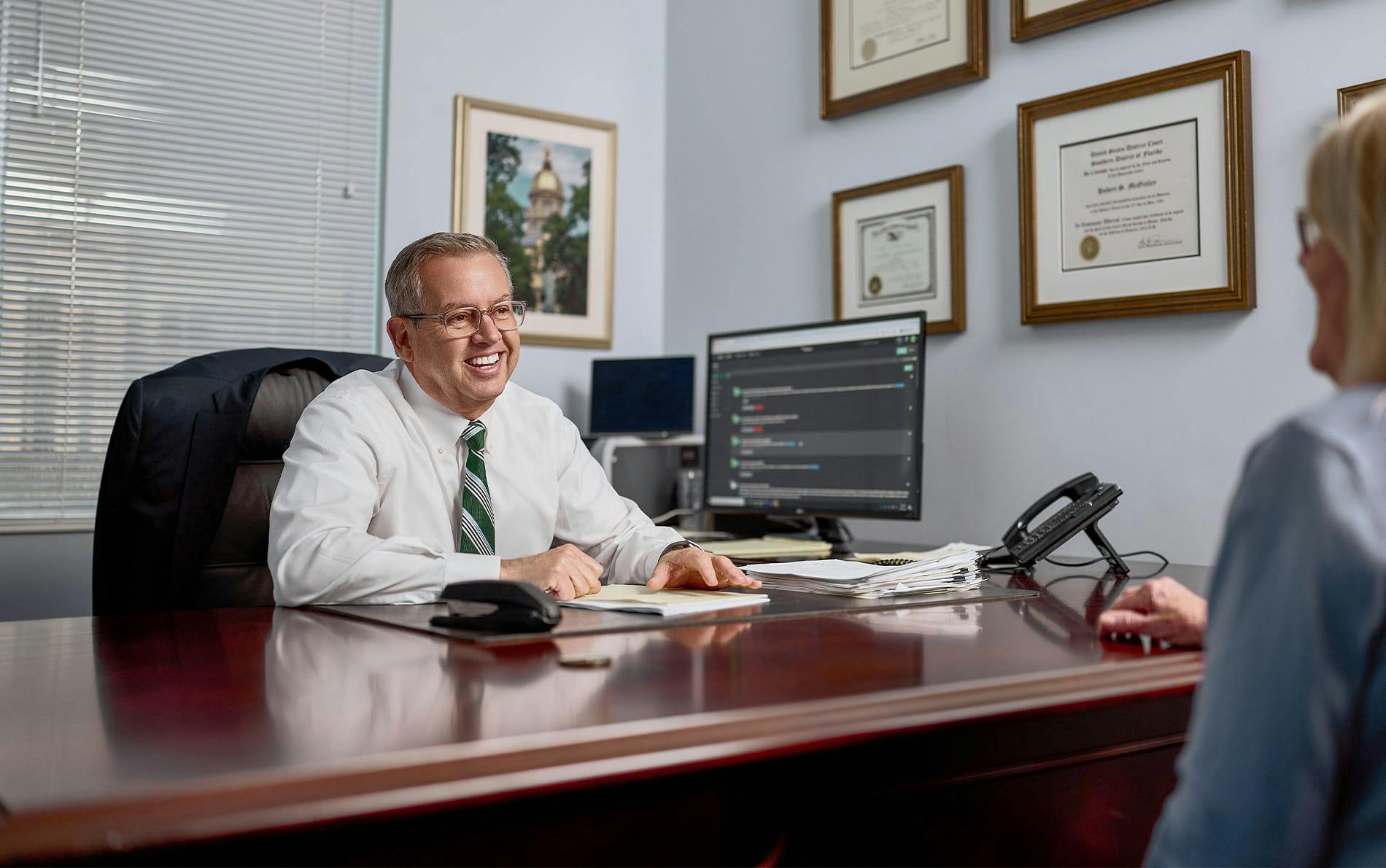 attorney smiling at clients