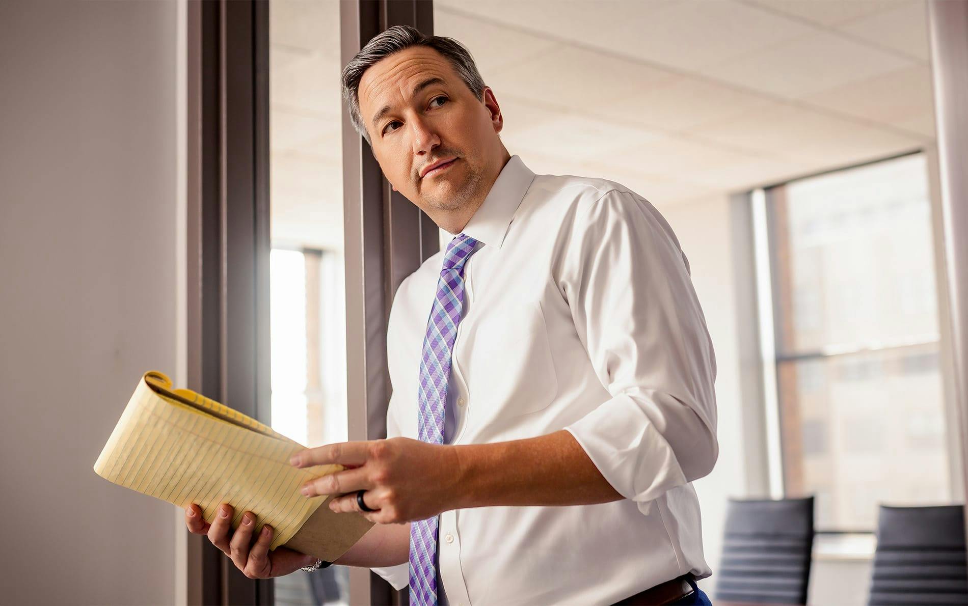 attorney holding paper