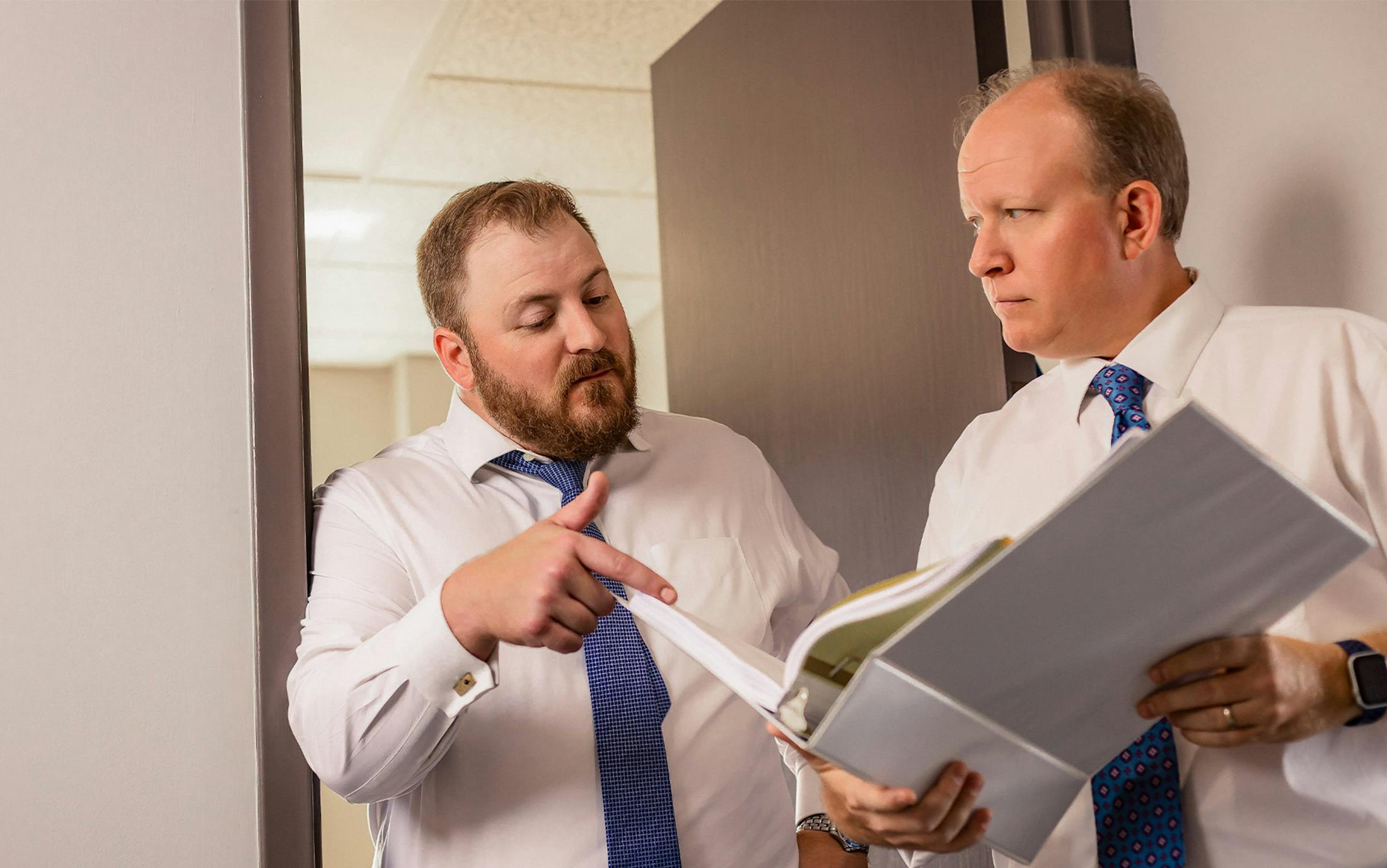 two attorneys looking at paperwork