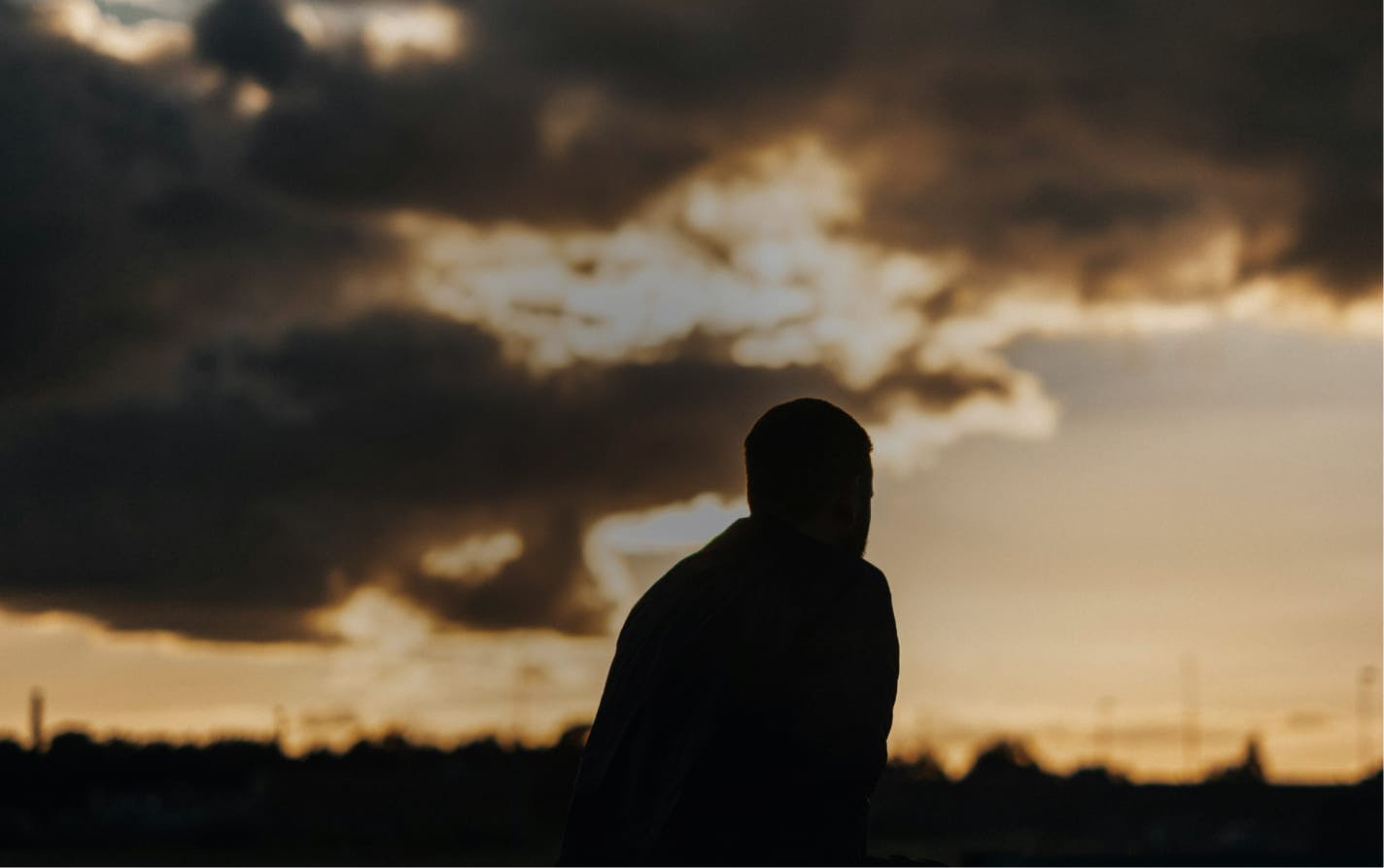 Silhouette of a man walking