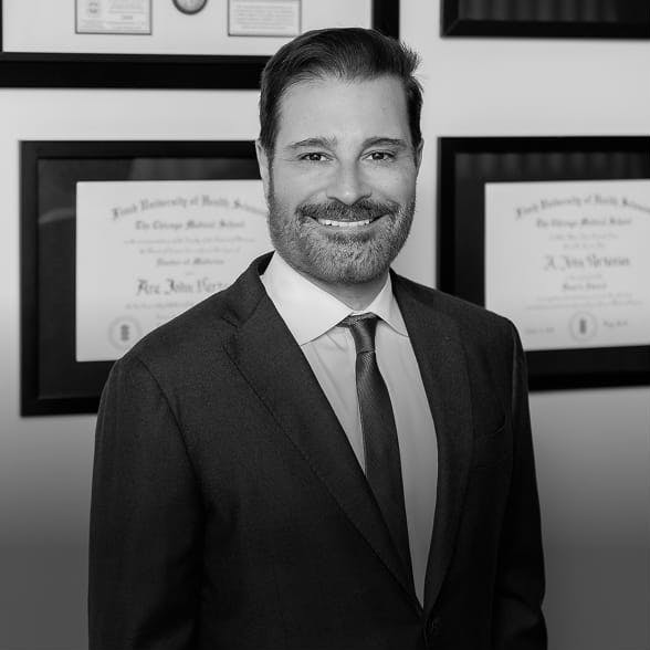 Dr. Vartanian in front of his plaques