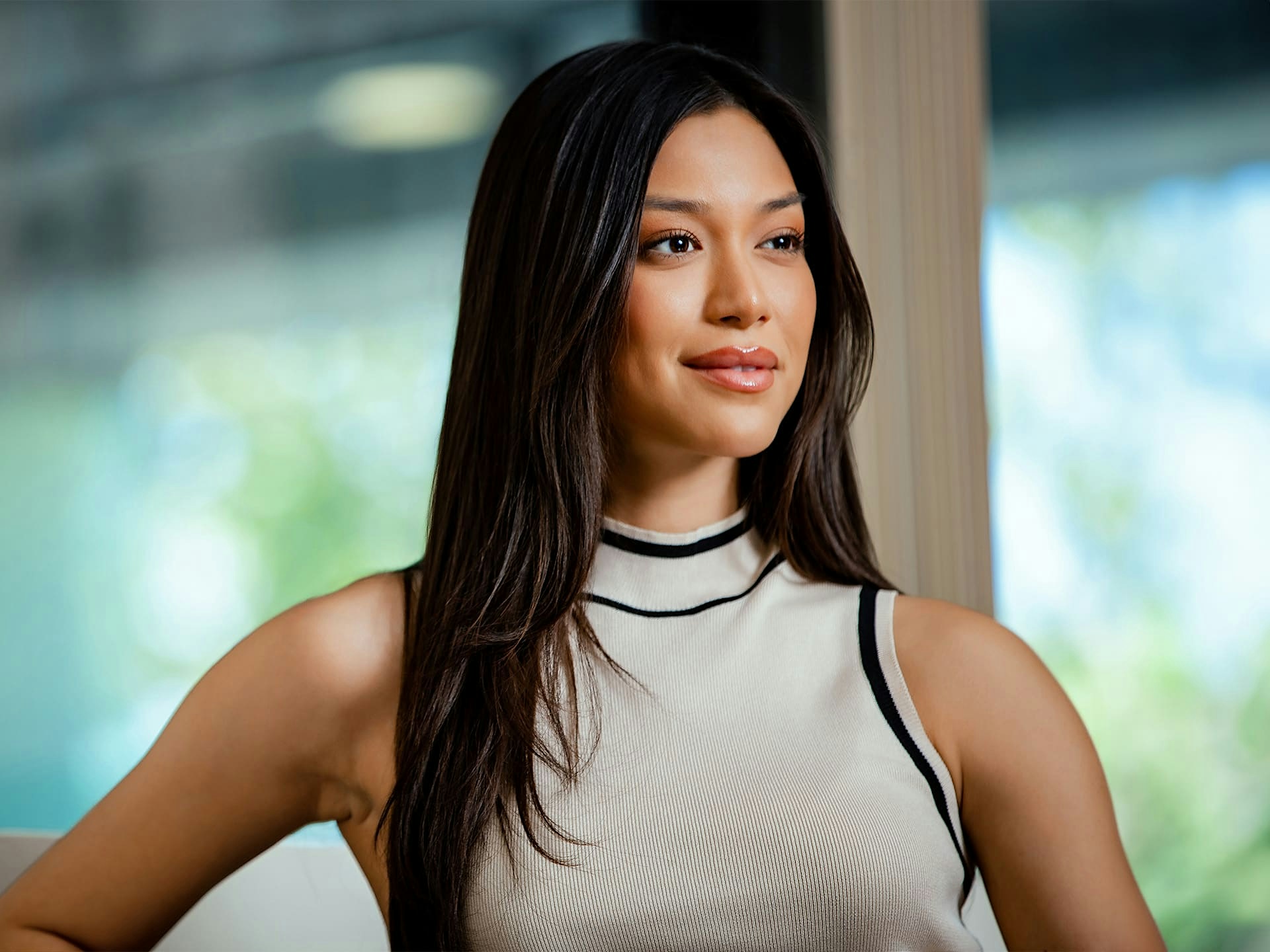 woman outside with white turtleneck tanktop