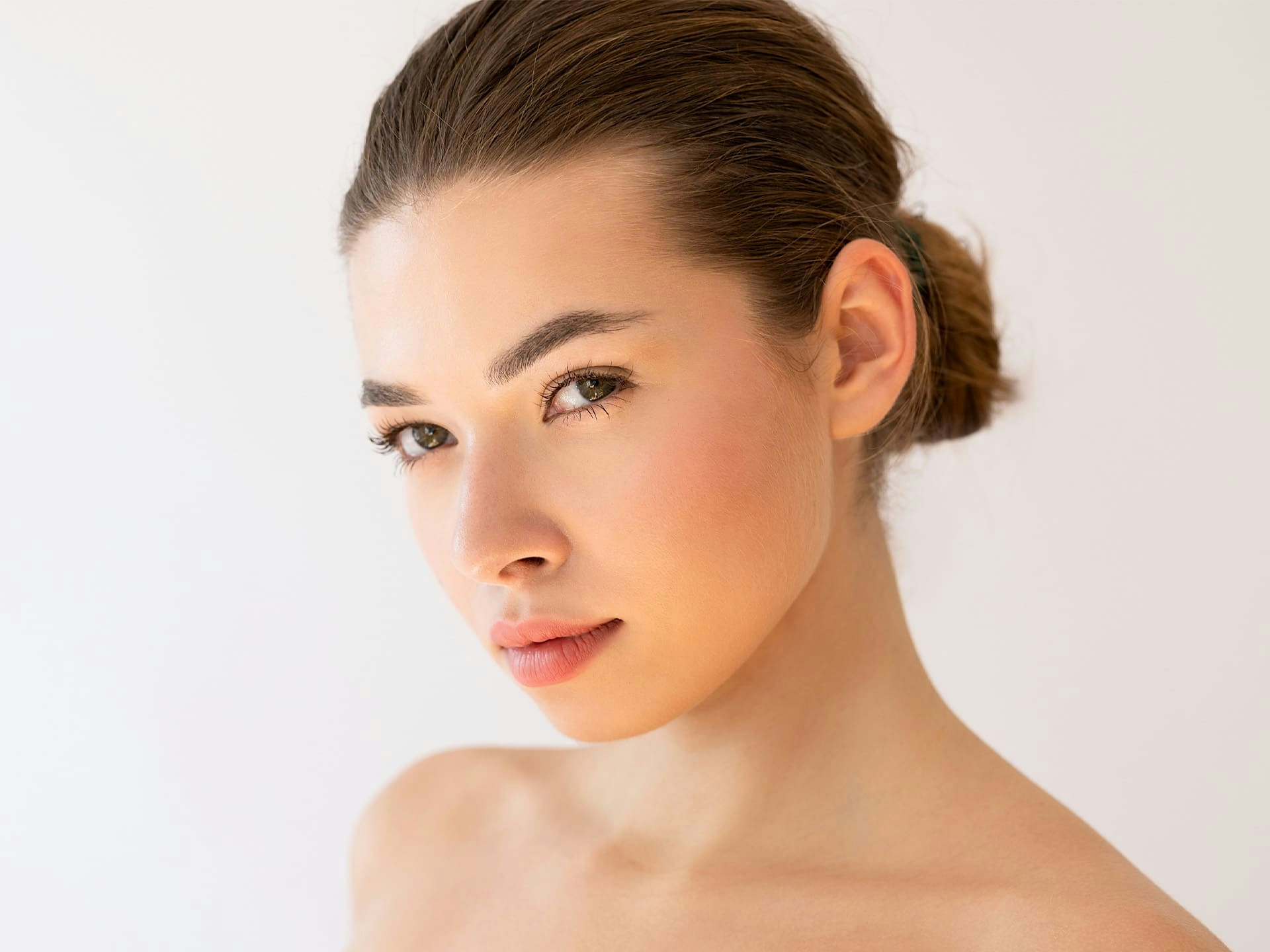 woman with slick messy bun