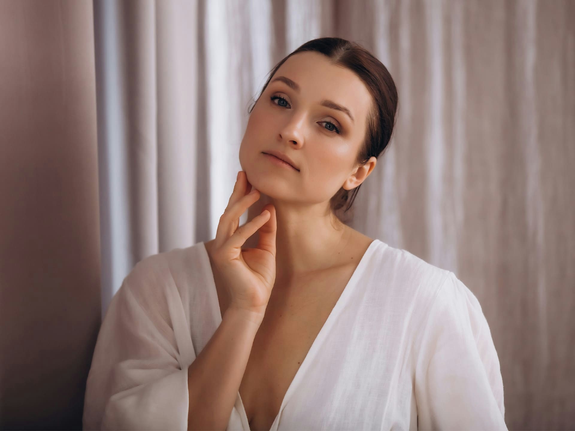 woman touching under her chin