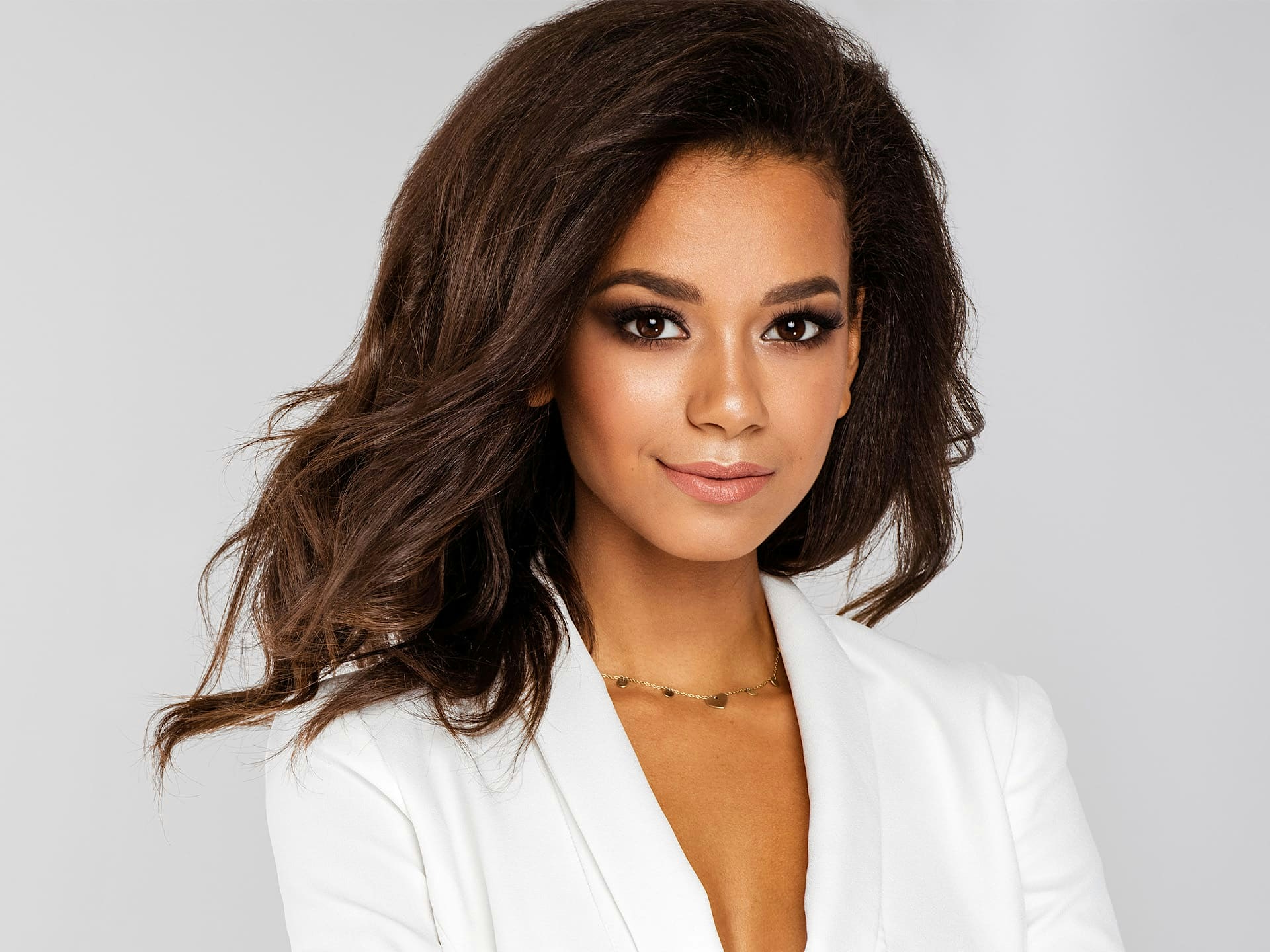 woman in white suit jacket