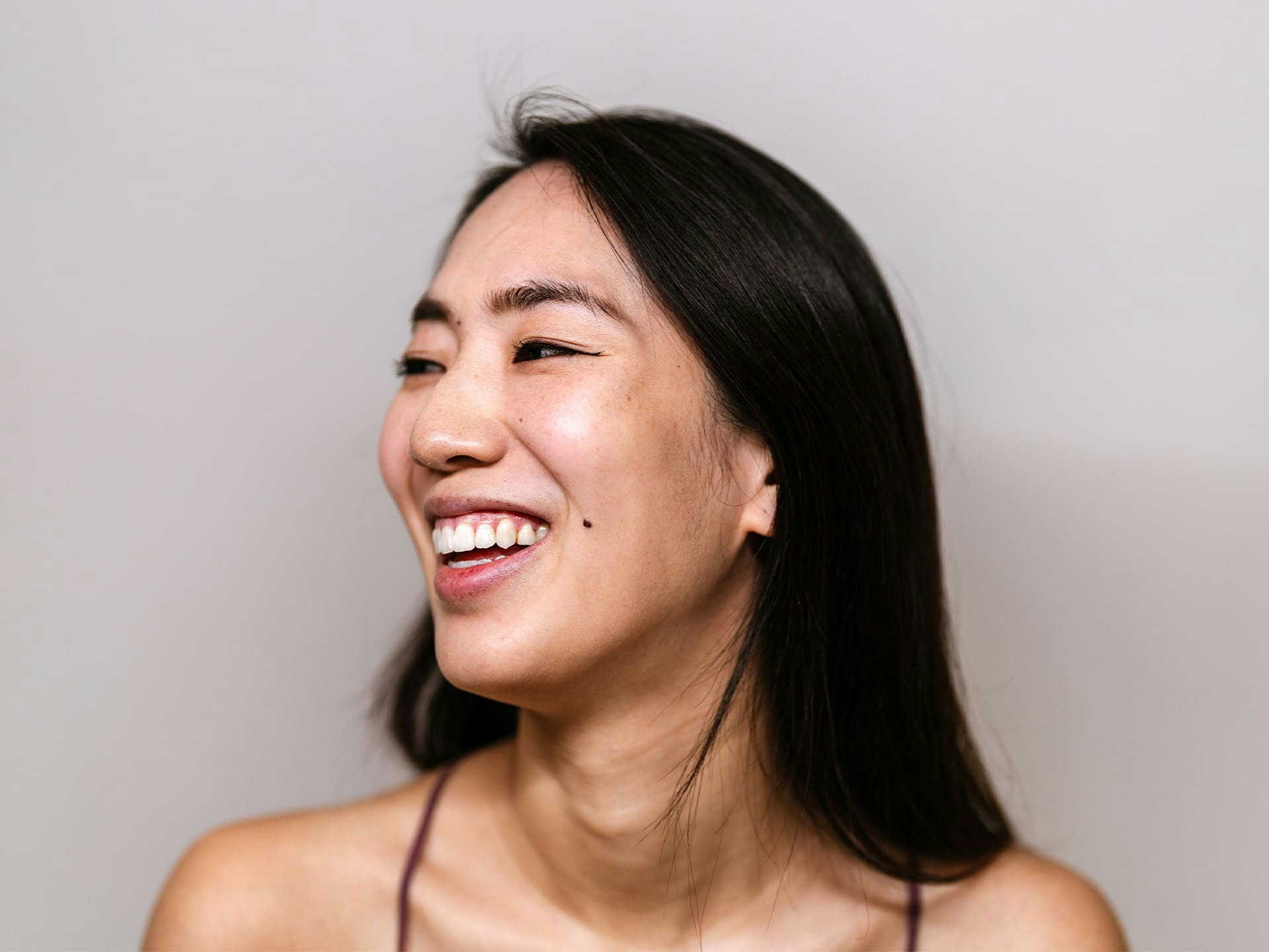 woman smiling to the left