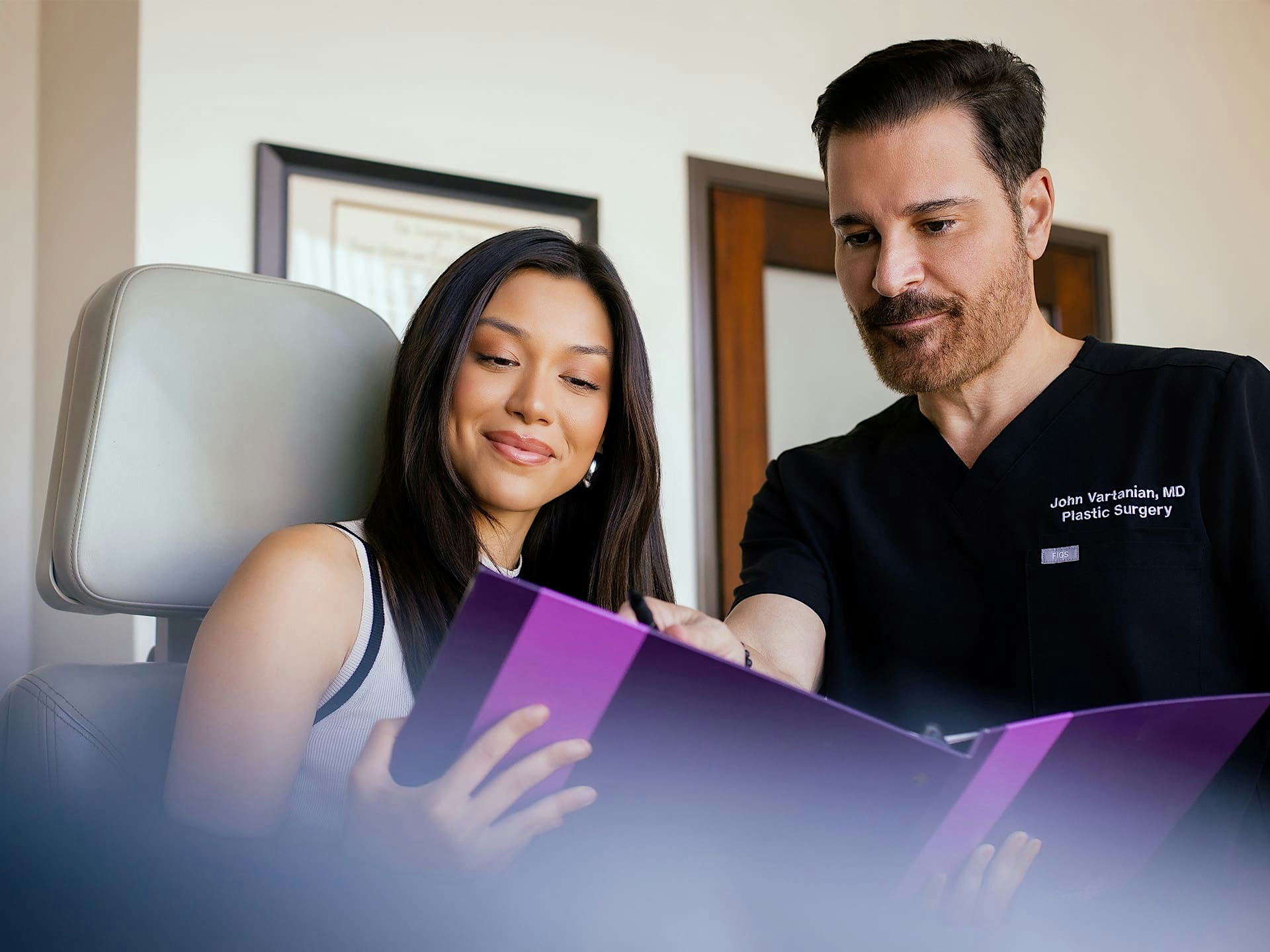 Dr. John Vartaian showing female patient procedures
