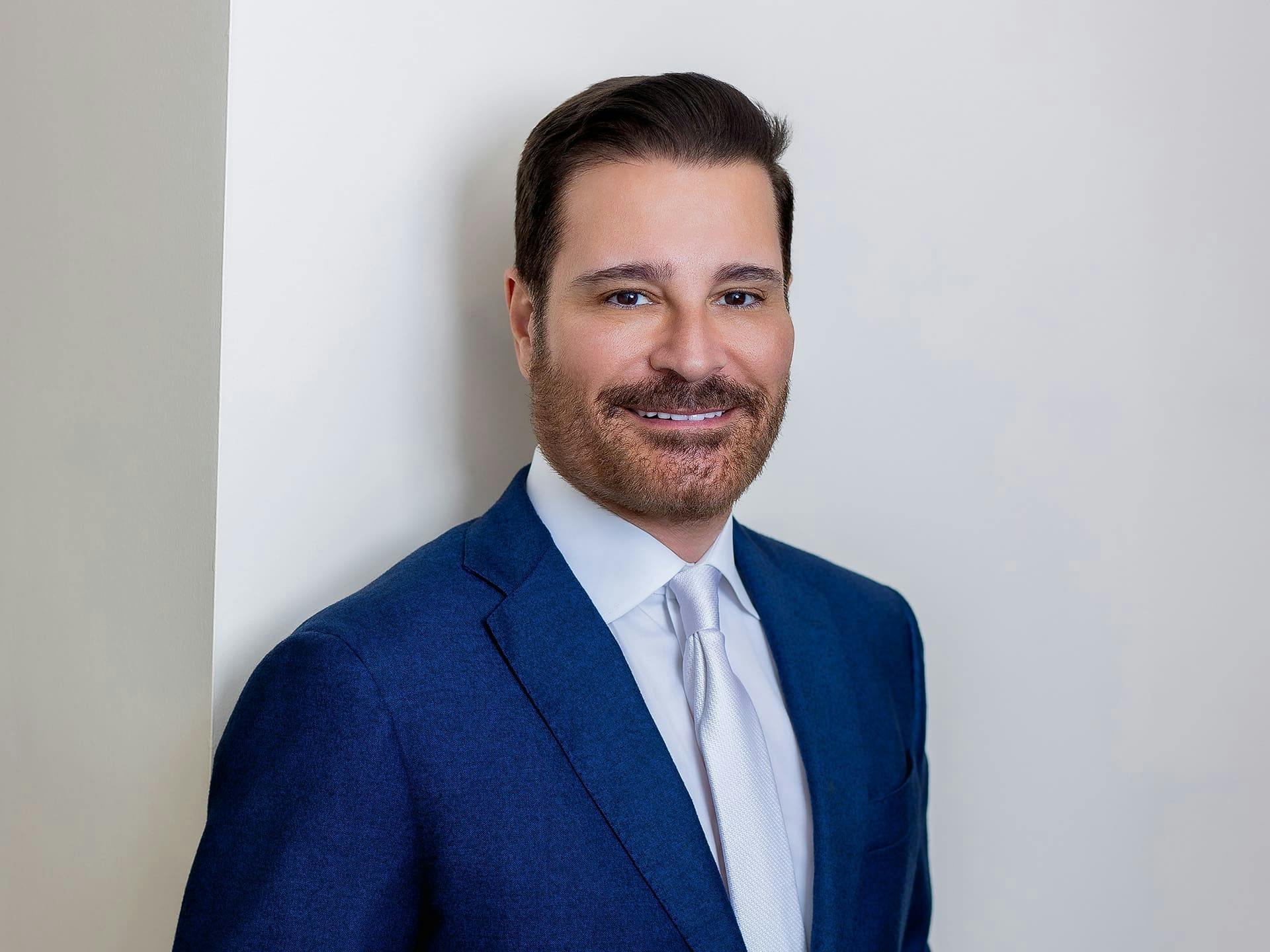 Dr. John Vartaian in dark blue suit