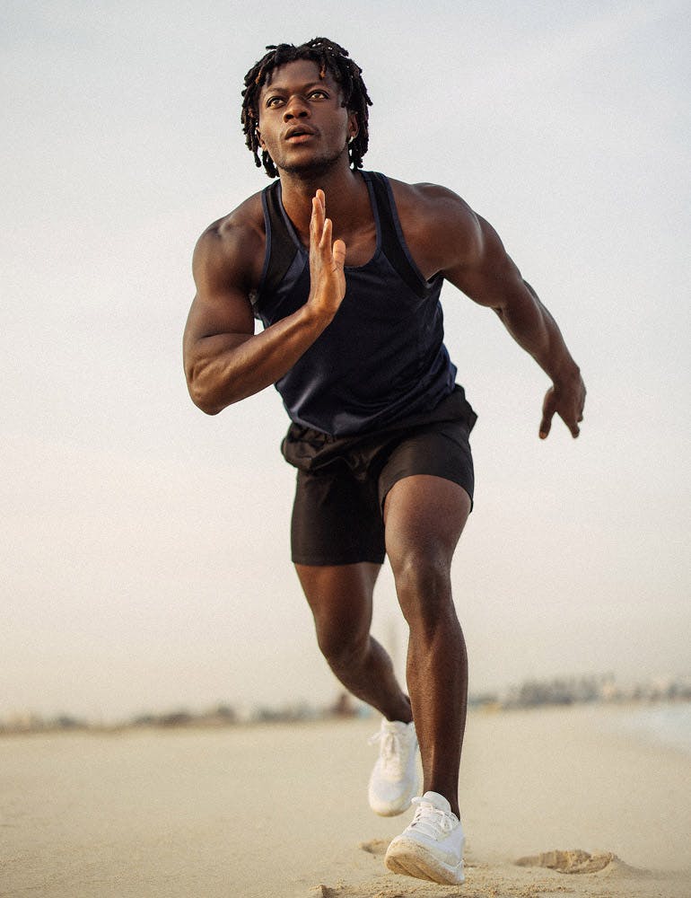 man running on a beach