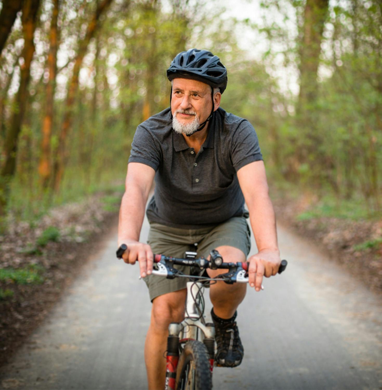 Man riding bike smiling