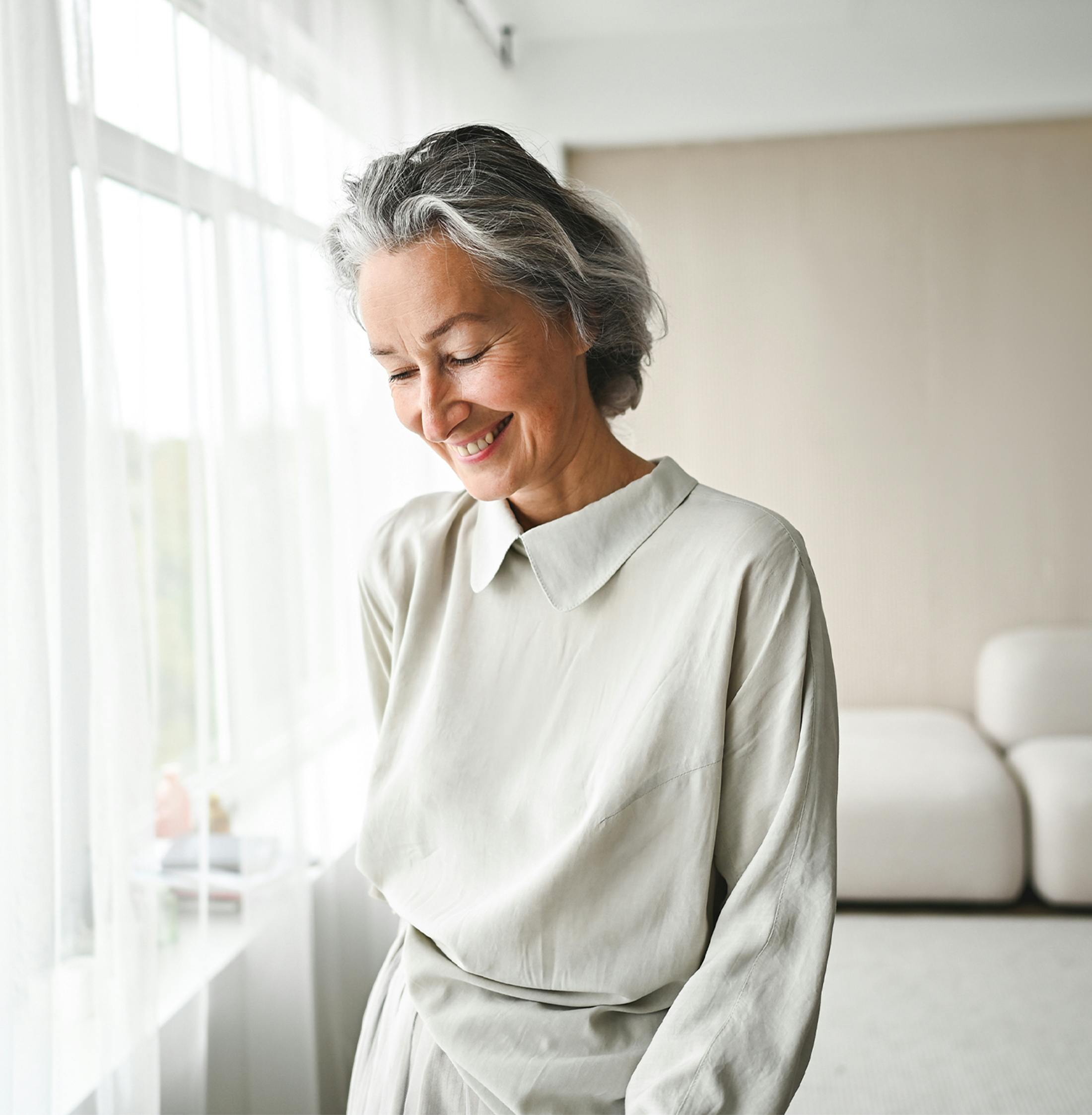 Woman looking down smiling