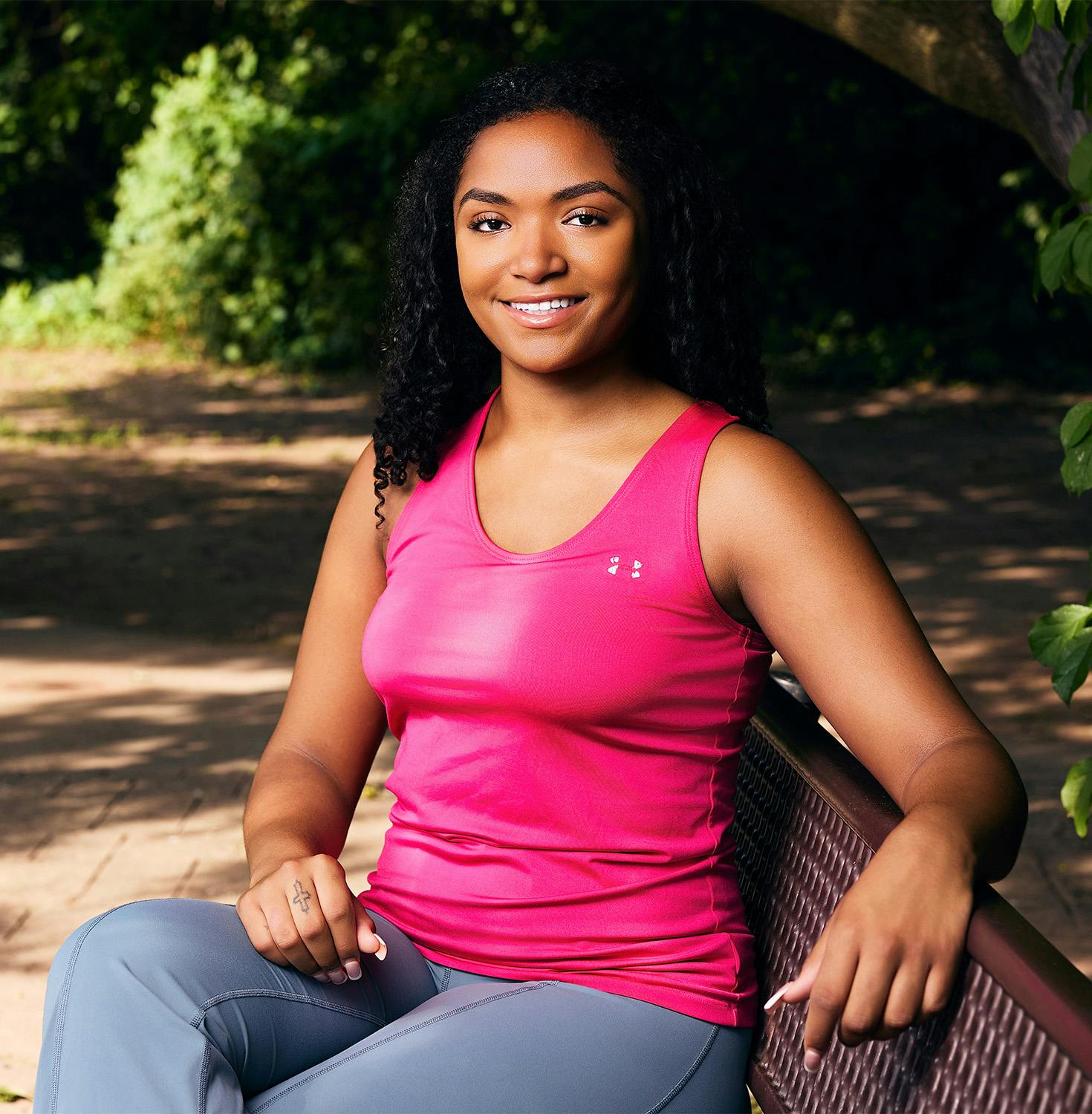 Woman smiling on bench