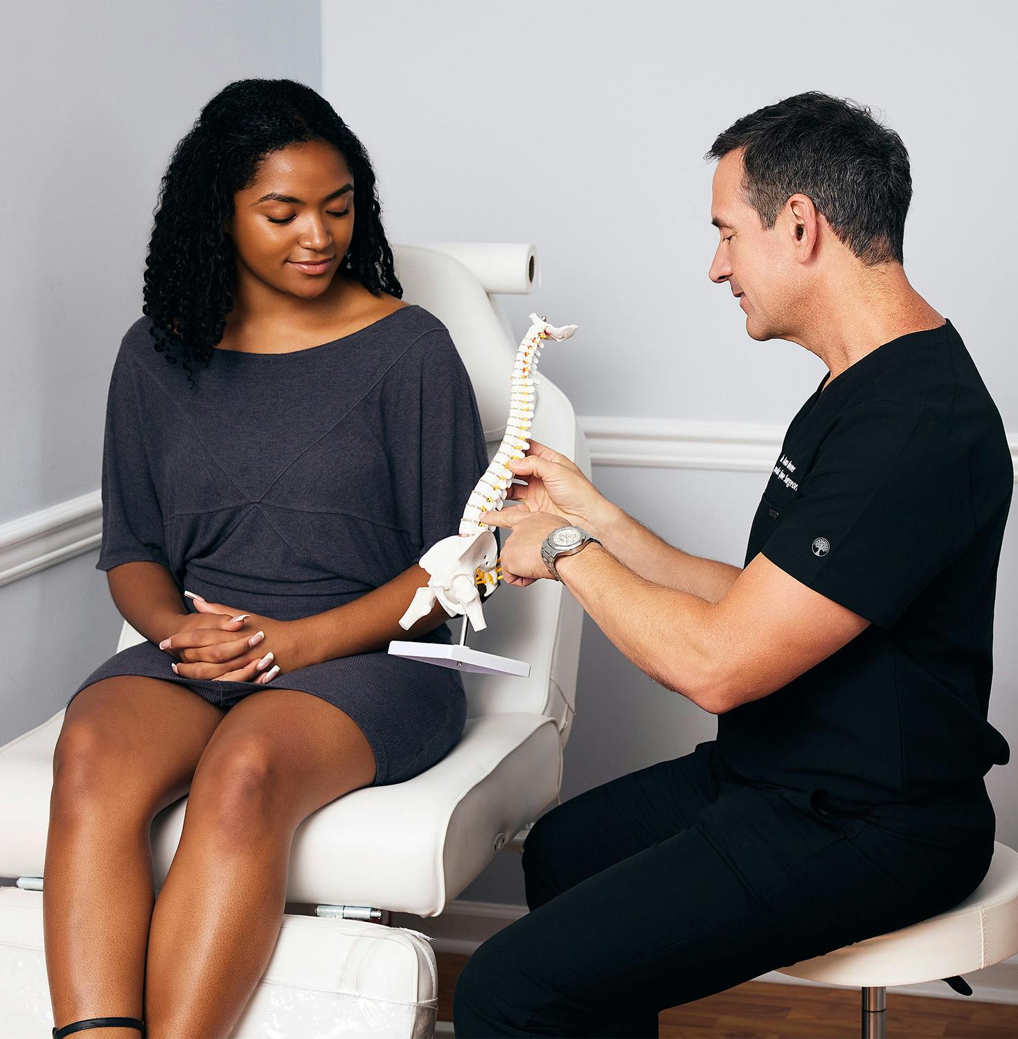 Dr. Krovner sitting with patient