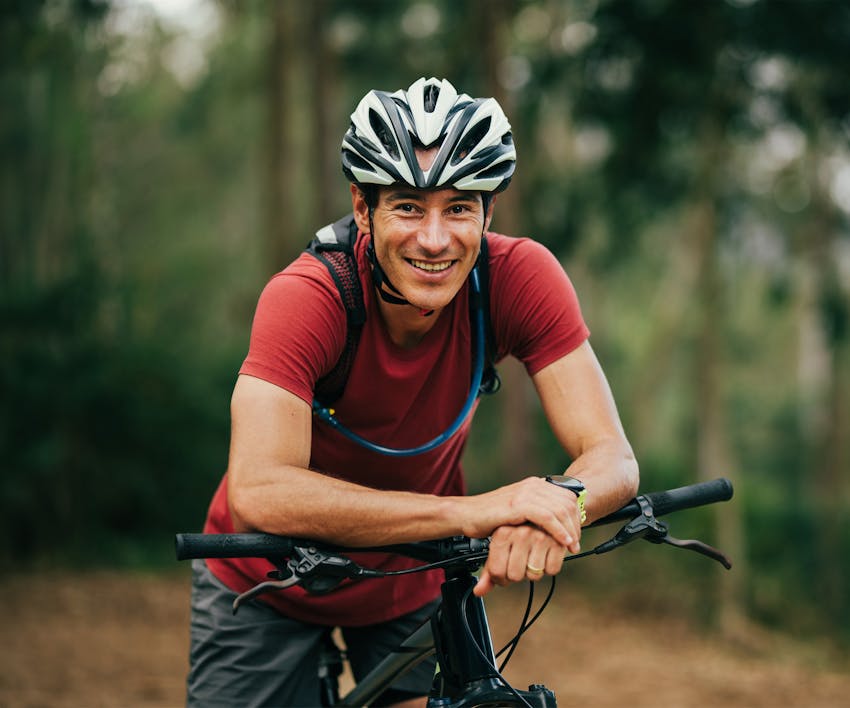 Man smiling on a bike