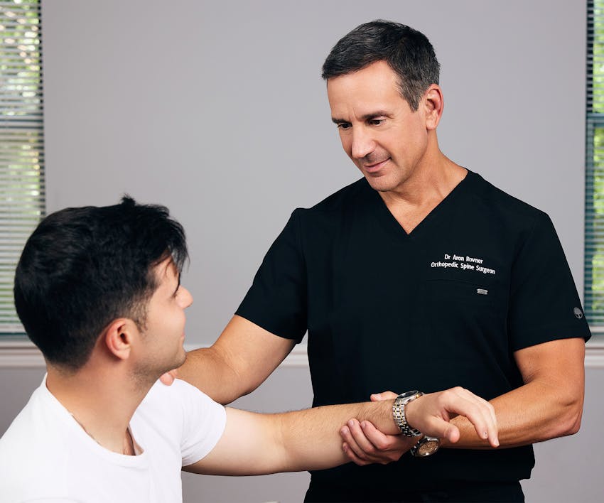 Dr.Rovner touching patient