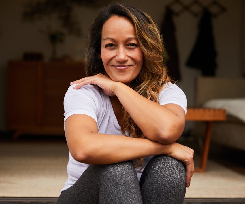 Woman smiling sitting down