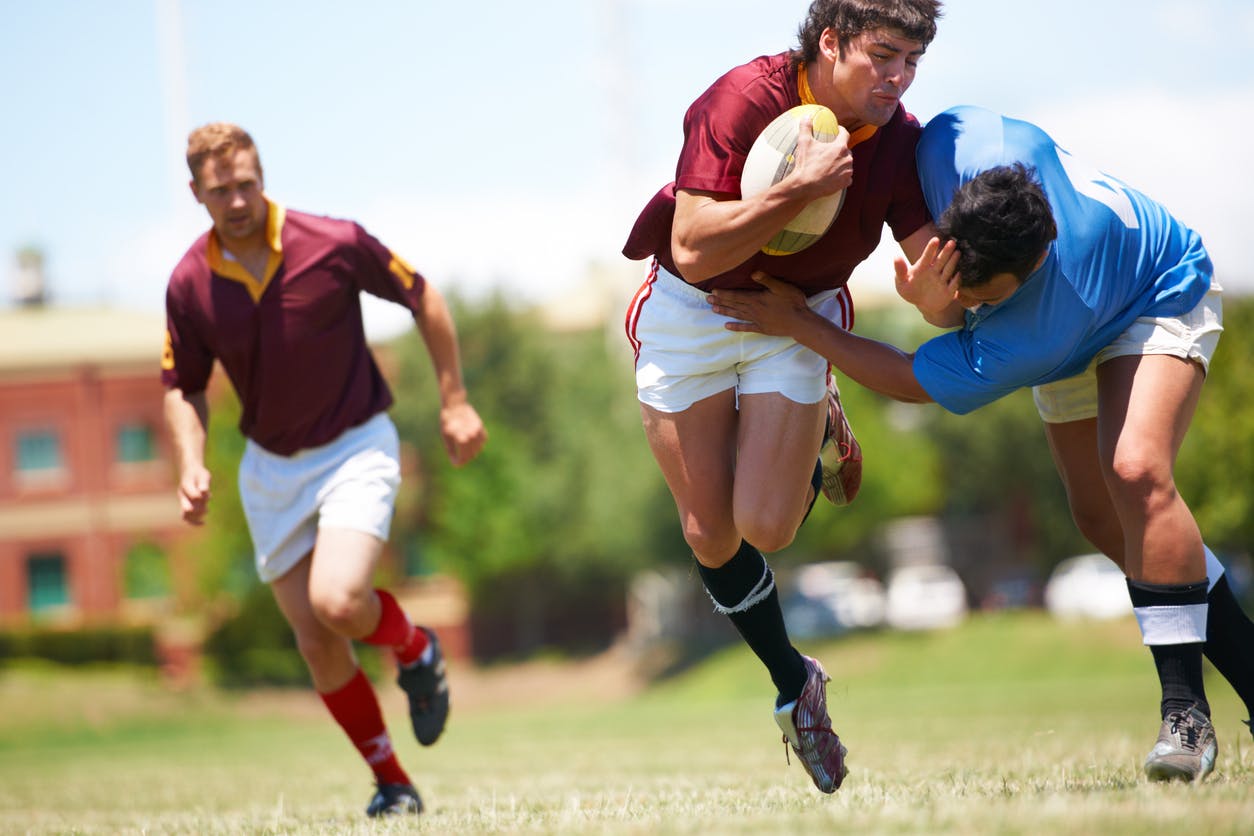 rugby players wrestling before hip injury