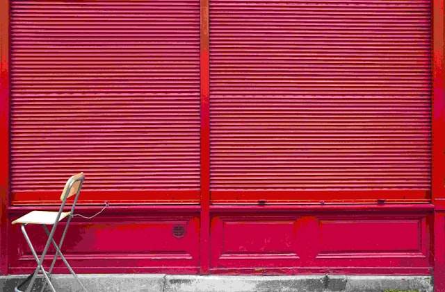 Chair sitting by a shop